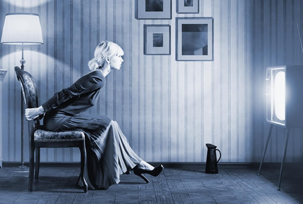 woman hypnotized by television